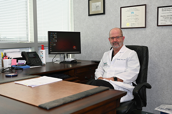 Dr Timothy Wilson at his desk